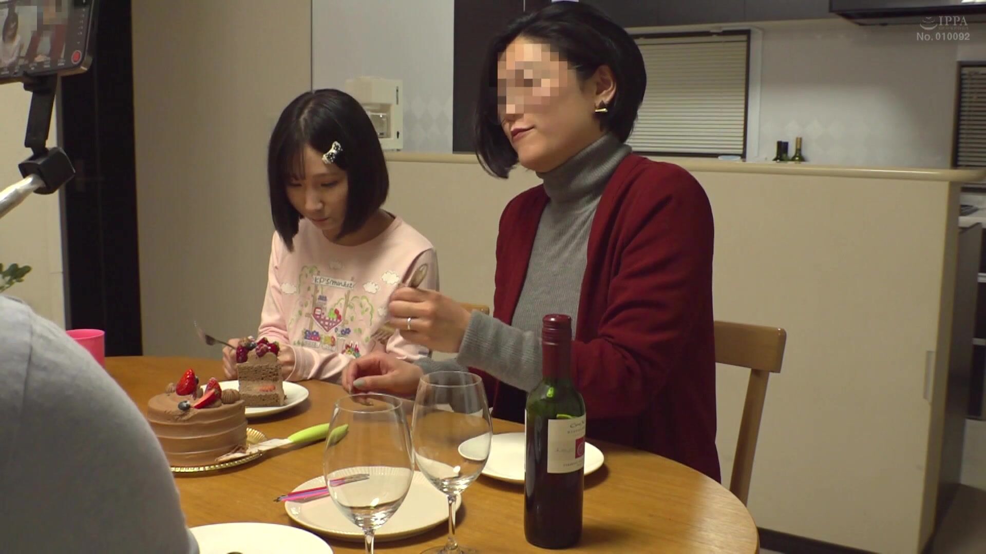 A father's hand gently touching his daughter's face