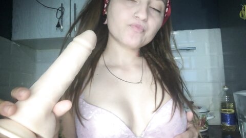 Redhaired Asian Girl Sucks A Dildo And In Her Thoughts There Is A Dick