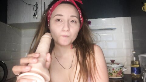 Redhaired Asian Girl Sucks A Dildo And In Her Thoughts There Is A Dick