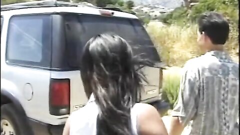 Watch The Slutty Asian Girl Sucking His Cock In The Back Of The Truck